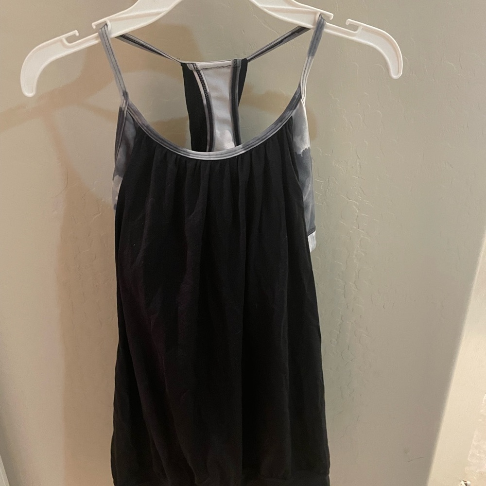 2 Lululemon tanks with built in sports bras. Size 4.